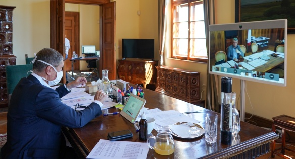Prime Minister Andrej Babiš in a discussion with Deputy Prime Minister Karel Havlíček during a video conference of the government, 7 May 2020.