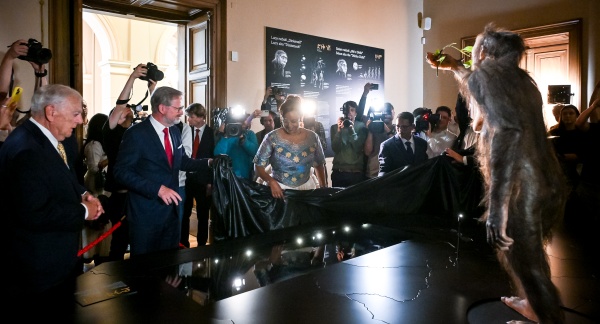 Prime Minister Petr Fiala and Ethiopian Minister of Tourism Selamawit Kassa unveil the Lucy fossil exhibit on August 25, 2025.